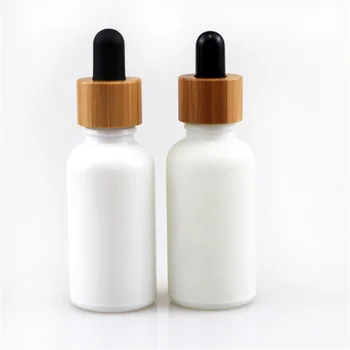 Продажба на едро, произведени по поръчка за козметични матови бели кръгли флакони-капкомер с бамбук капак, етерично масло, парфюм, опаковка на продукти за грижа за кожата