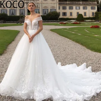 Сватбена рокля MACDUGAL с 3D цветя, расшитое мъниста, корсет с V-образно деколте, мека окото, расшитая перли, лъскава обемна бродерия и дантела.